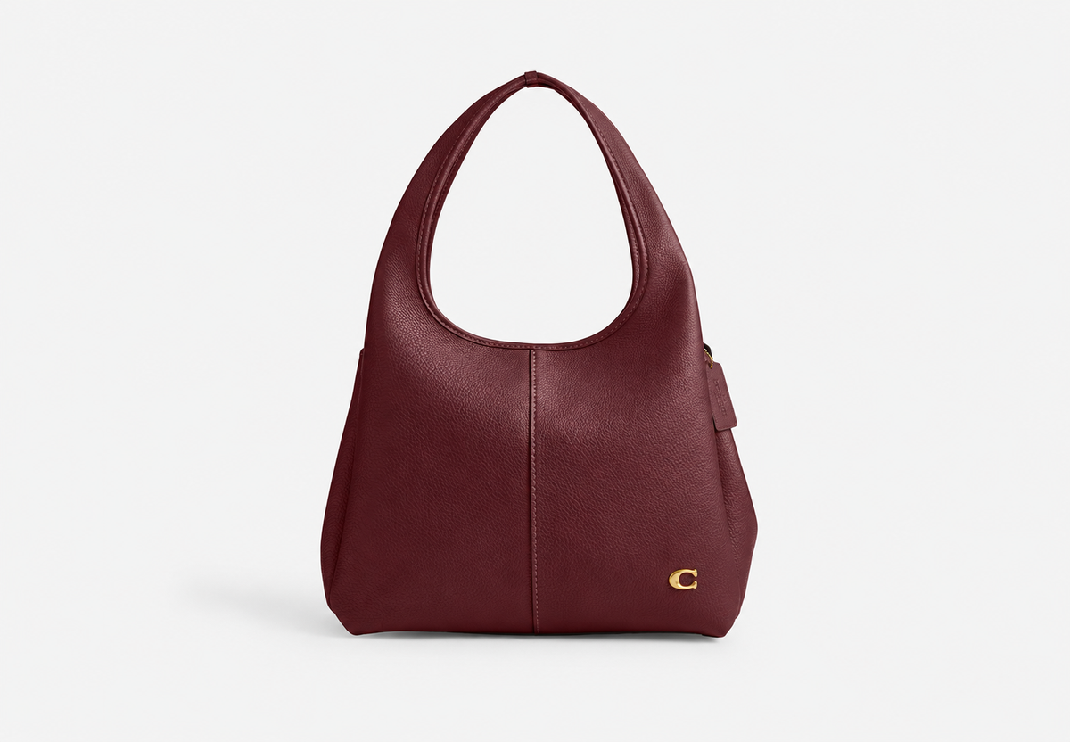 Burgundy pebble leather tote bag with curved handles and gold-tone C logo, front view