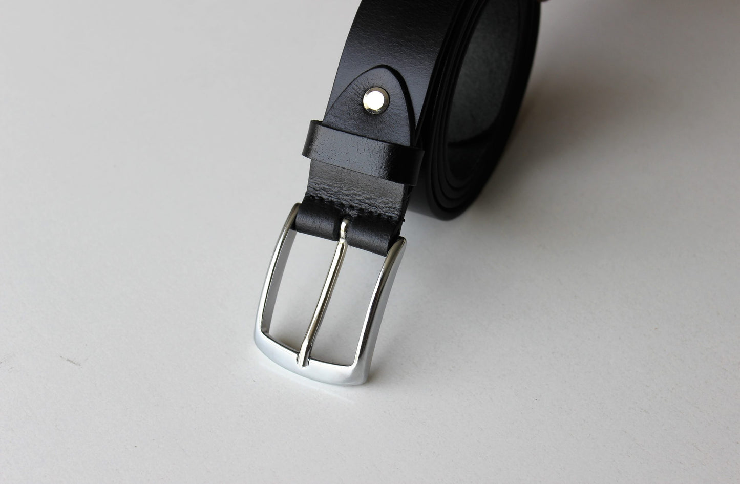 Black Leather Belt with Sleek Silver Buckle