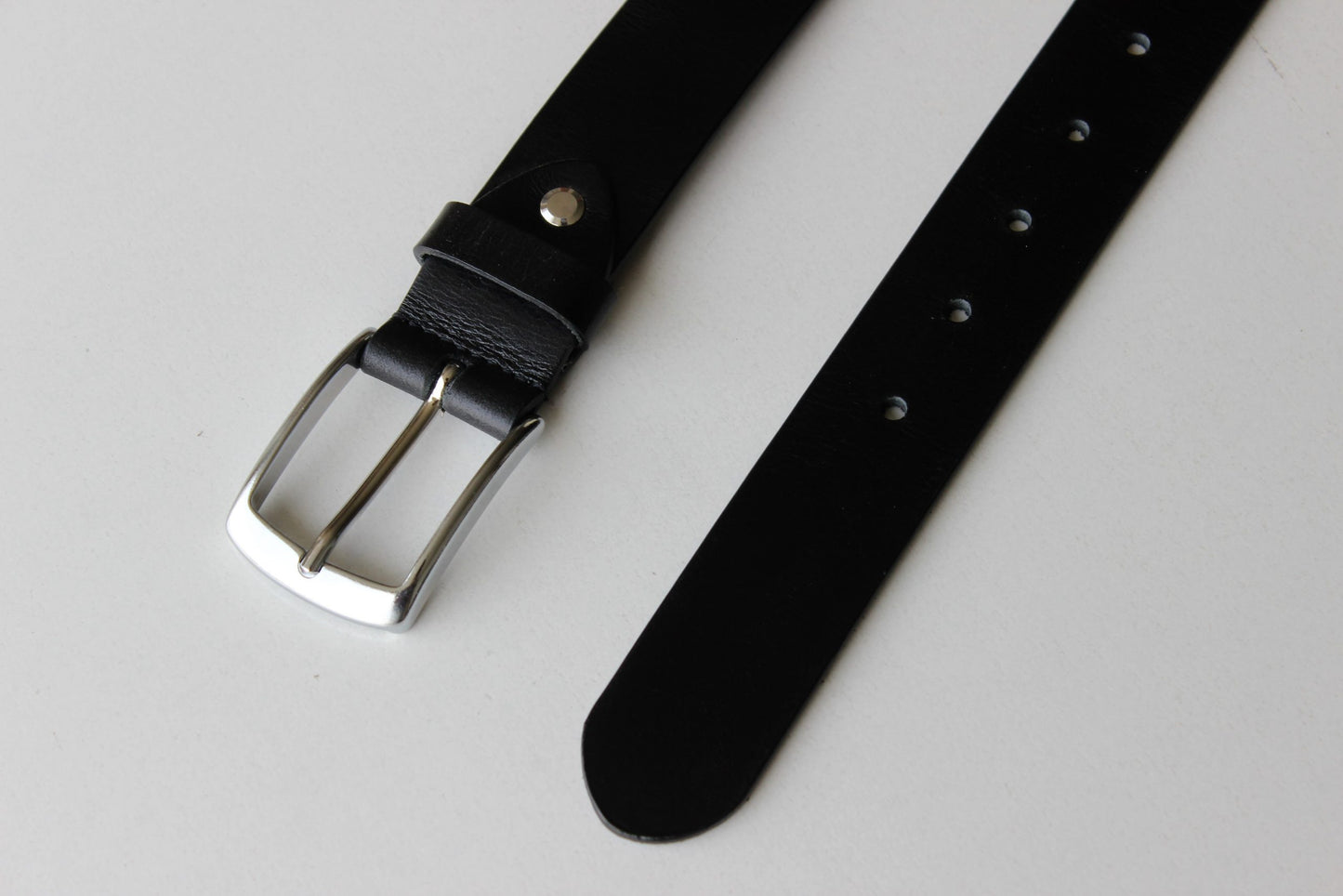 Black Leather Belt with Sleek Silver Buckle